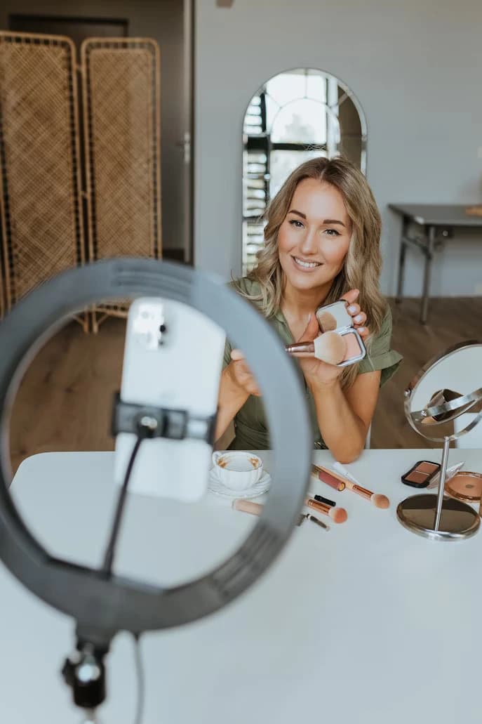 Content creator filming with a ring light